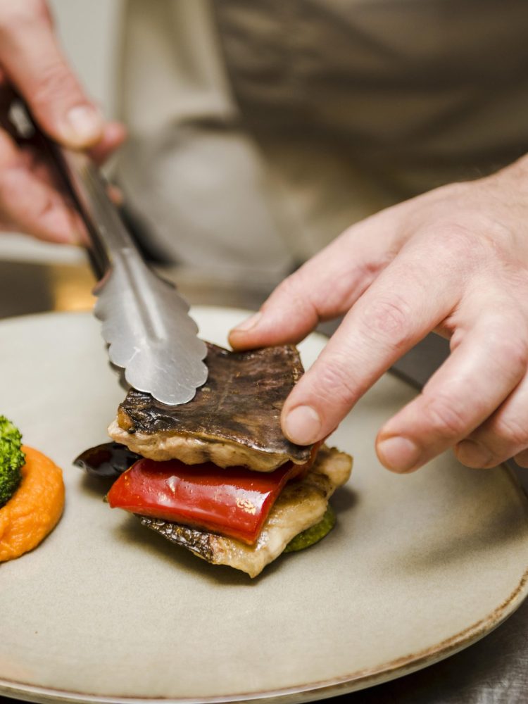 chef-preparing-delicious-fish-close-up
